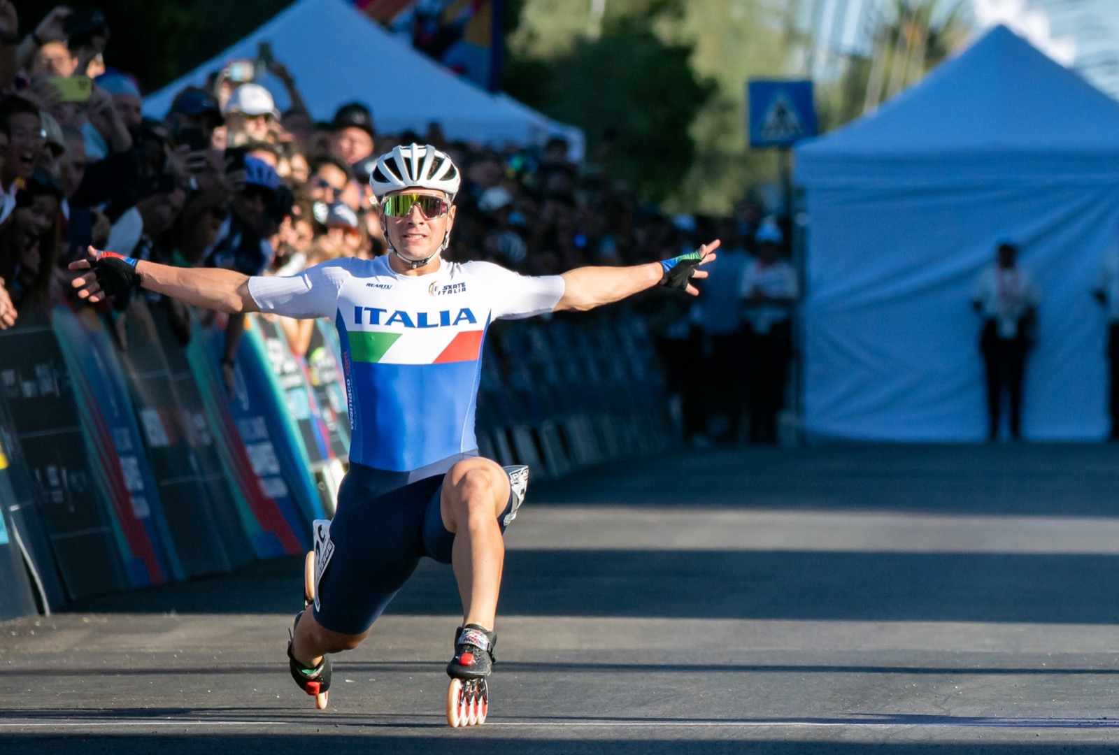 Alessio Piergigli crossing the finish line at the World Skate Games in Pescara