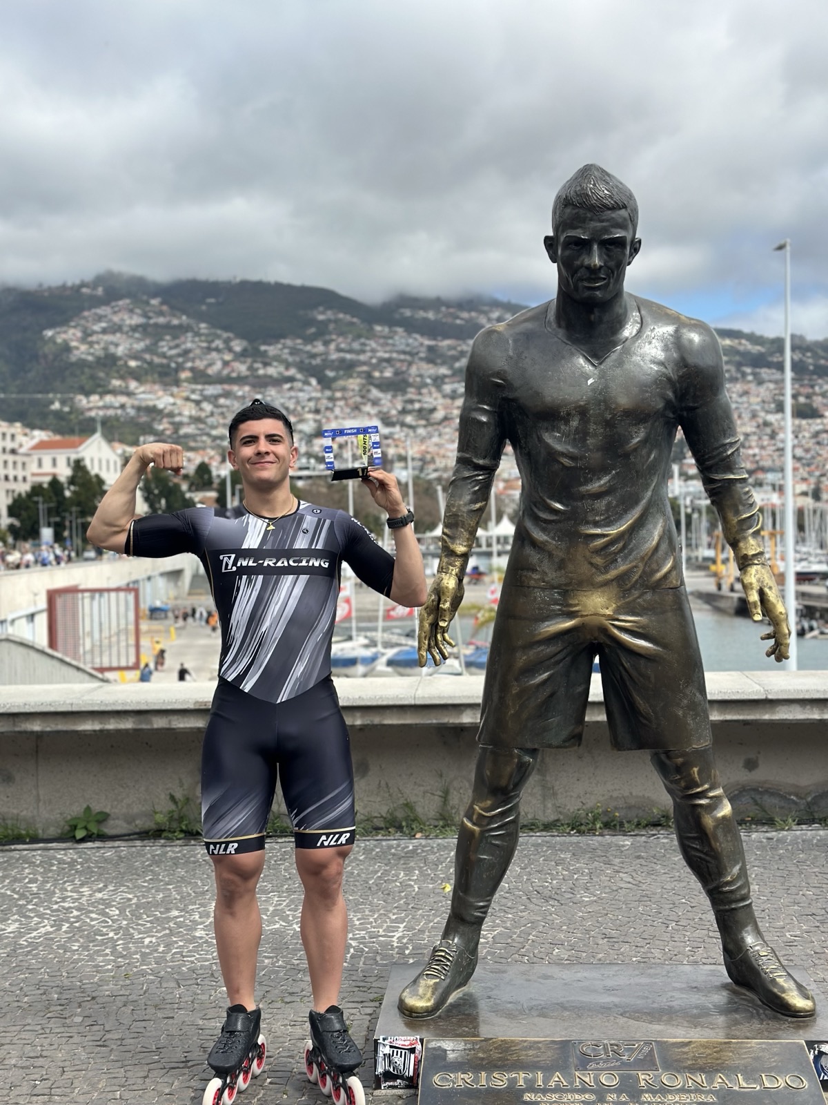 Alessio Piergigli next to the Cristiano Ronaldo statue in Funchal, Madeira